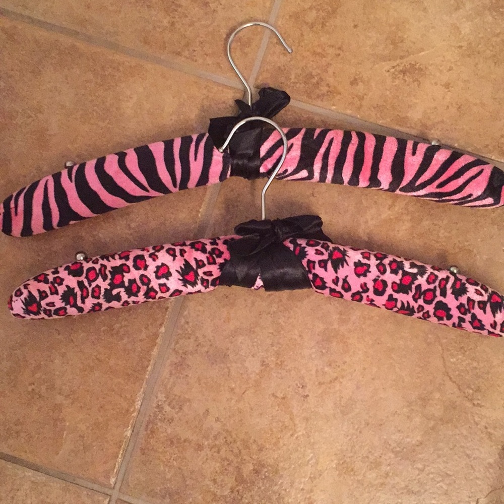 2 padded animal print clothes hangers.
